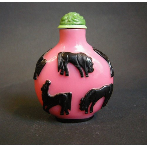 Glass Overlay snuff bottle pink and black sculpted with eight horses of legendary Mu Wang